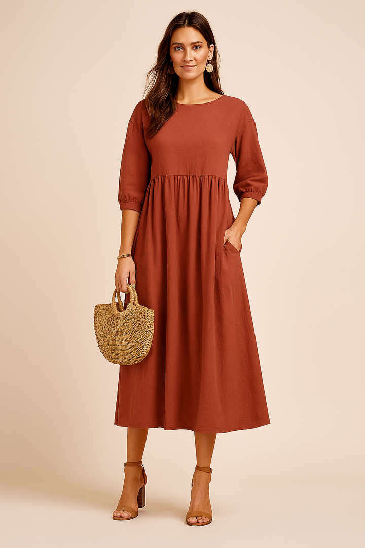 Effortless elegance in a midi dress with 3/4 sleeves, perfect for the modern woman.
