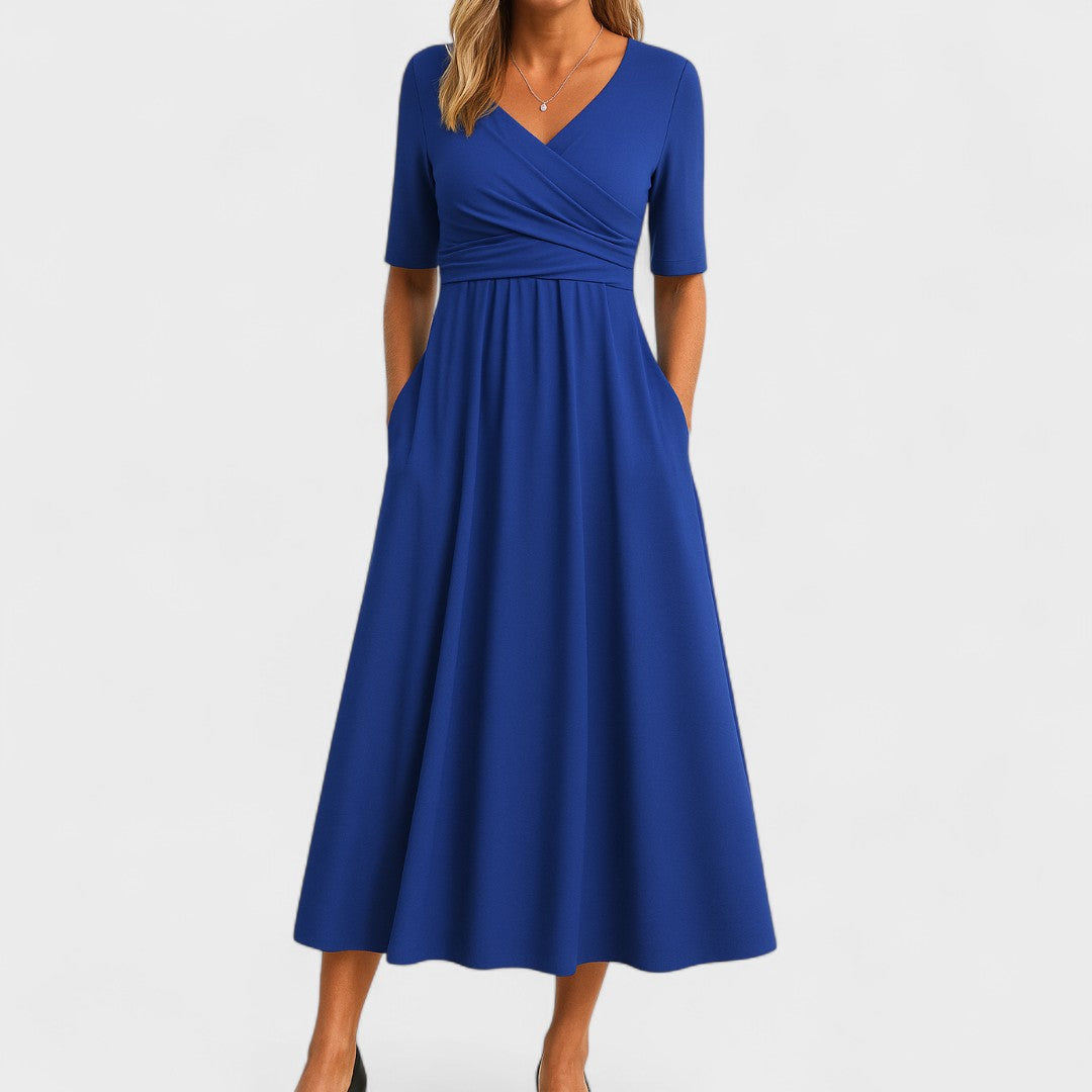 Elegant women's midi dress with a flattering V-neck, elbow sleeves, and a chic flared skirt. Features pockets.
