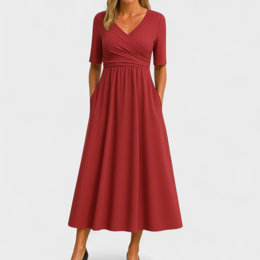 Women's comfortable midi dress featuring a flattering V-neck, elbow sleeves, and essential deep pockets.