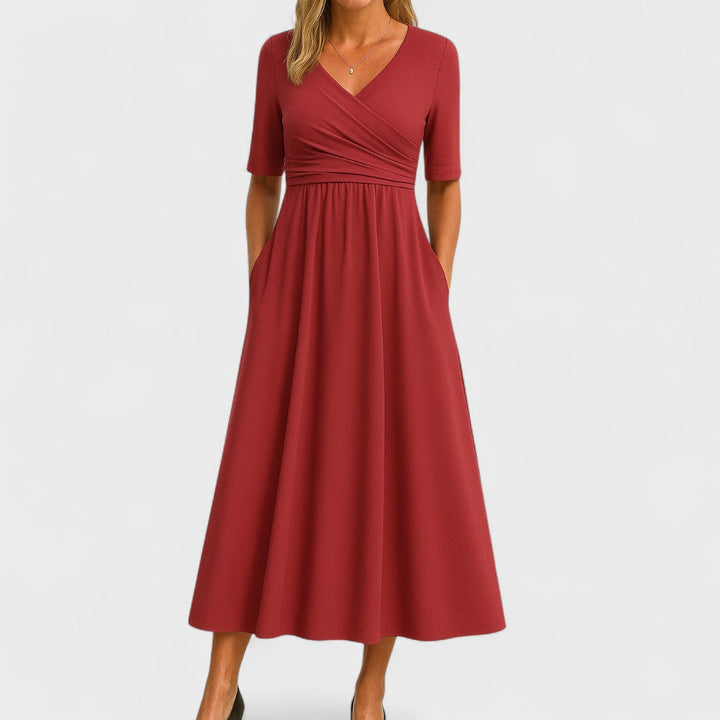 Women's comfortable midi dress featuring a flattering V-neck, elbow sleeves, and essential deep pockets.