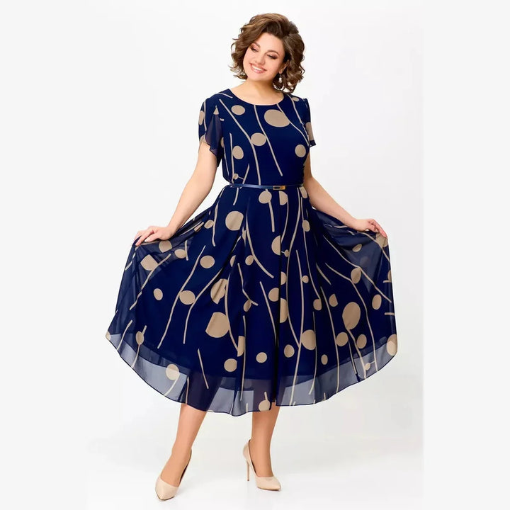 Women's elegant navy polka dot midi dress, a timeless and versatile design for summer and occasion wear.