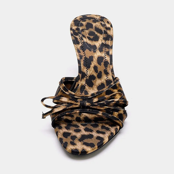 Back angle of women's stylish kitten heel mule sandals. Open toe slip-on design with an elegant heel.