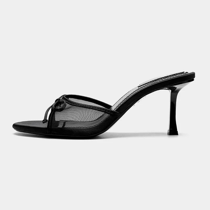Elegant open toe mule sandals for women with a low kitten heel. Slip-on design, perfect versatile footwear.