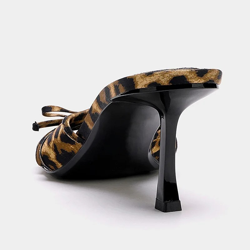 Comfortable women's open toe kitten heel mule sandals. Fashionable slip-on design for everyday elegance.