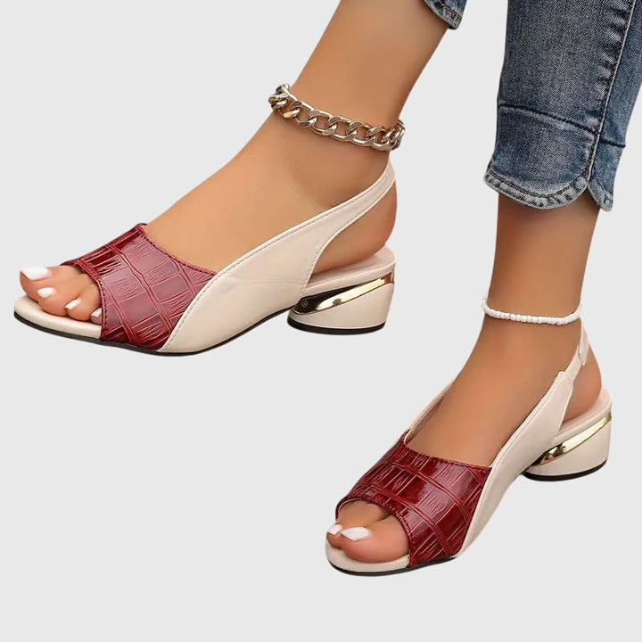 Elegant women's open-toe sandals with a sturdy block heel and subtle metallic accents for summer.