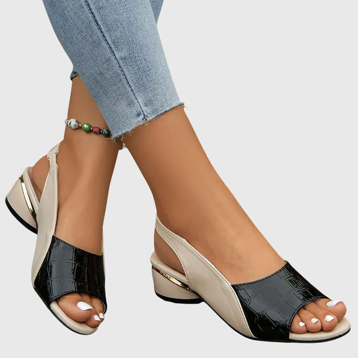 Stylish women's open-toe sandals with a comfortable block heel, perfect elegant footwear for summer.