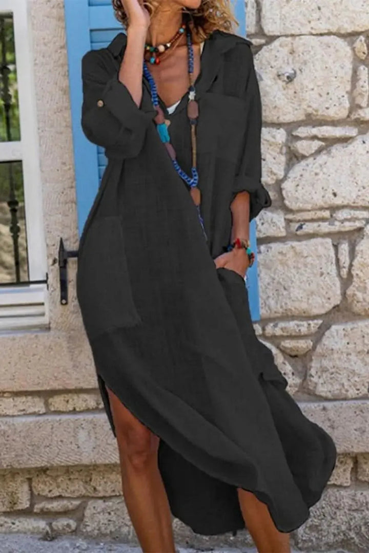 Women's elegant oversized midi shirt dress. Comfortable V-neck for casual wear or summer fashion.
