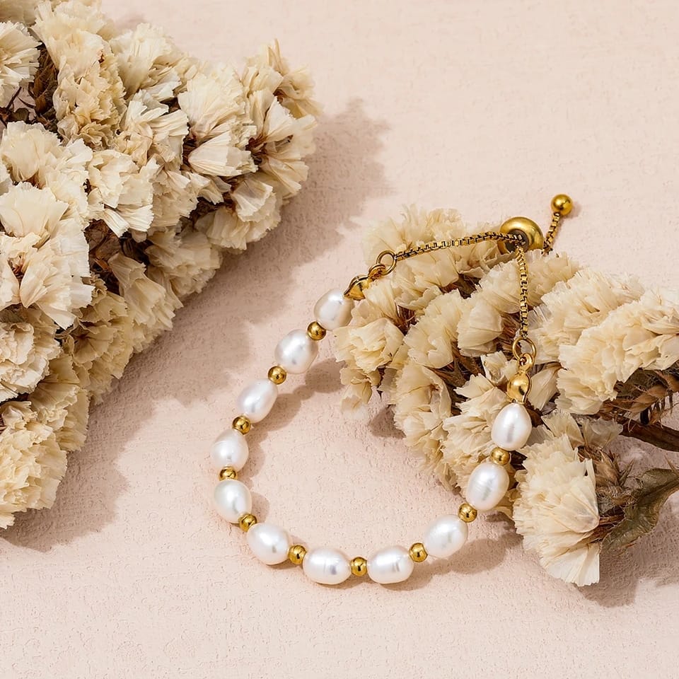 Stylish women's gold & pearl bracelet, a versatile delicate wrist jewelry piece with classic charm.