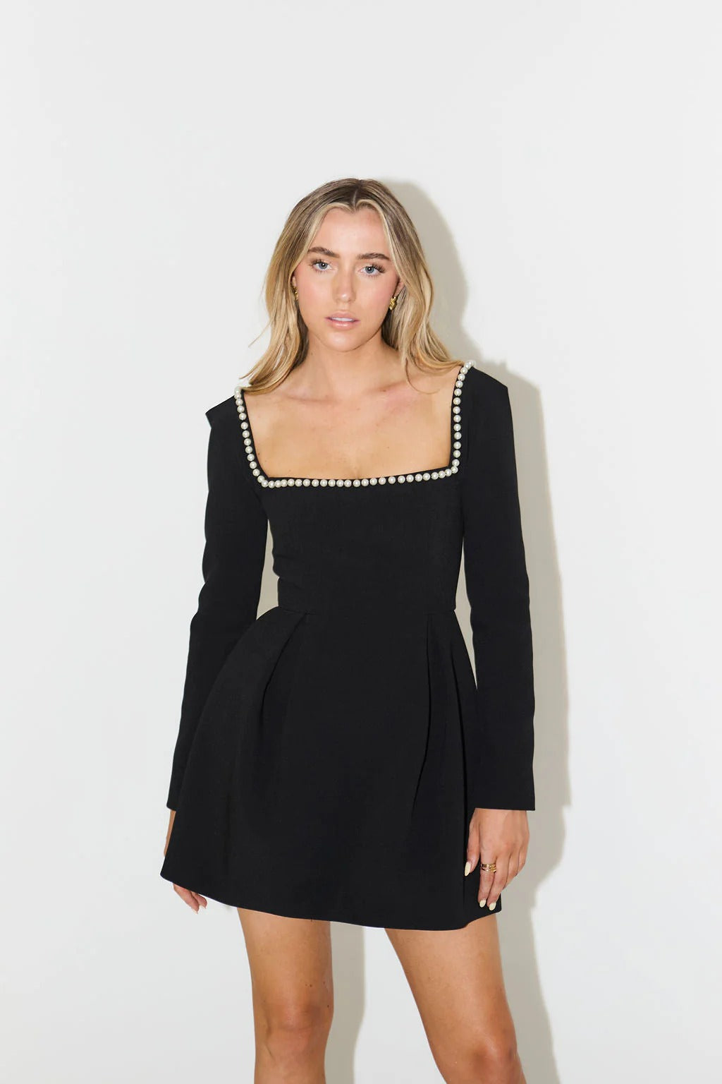 Women's elegant pearl trim mini dress with long sleeves, perfect for cocktails & parties.