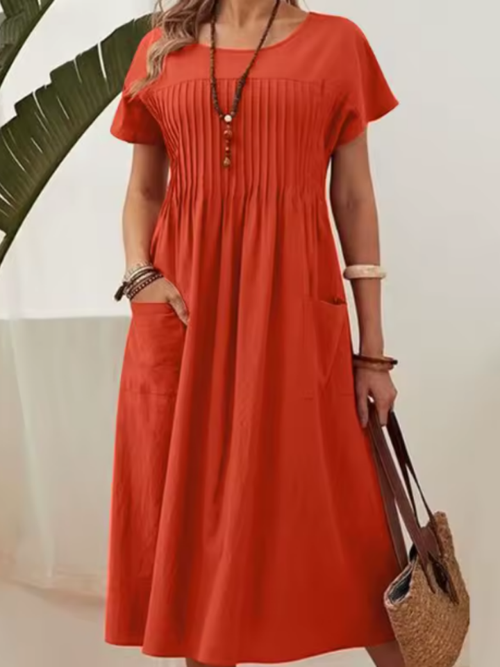 Comfortable women's short sleeve midi dress with pleated bodice & side pockets, perfect casual summer or spring fashion.