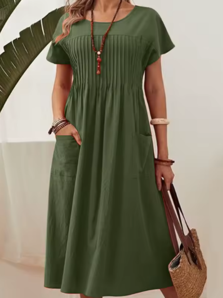 Versatile women's everyday midi dress with a flattering pleated bodice, short sleeves, & handy side pockets.