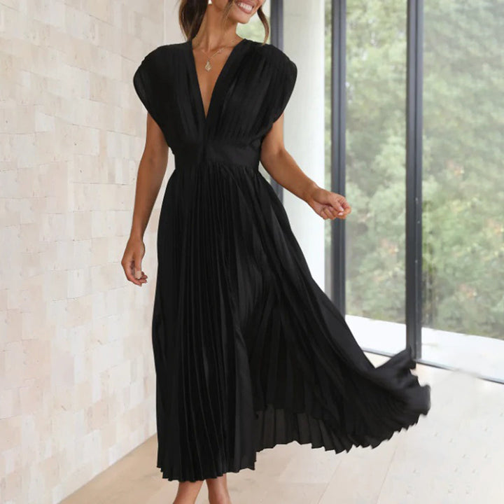 Chic women's V-neck maxi dress with beautiful pleating, suitable for formal wear.