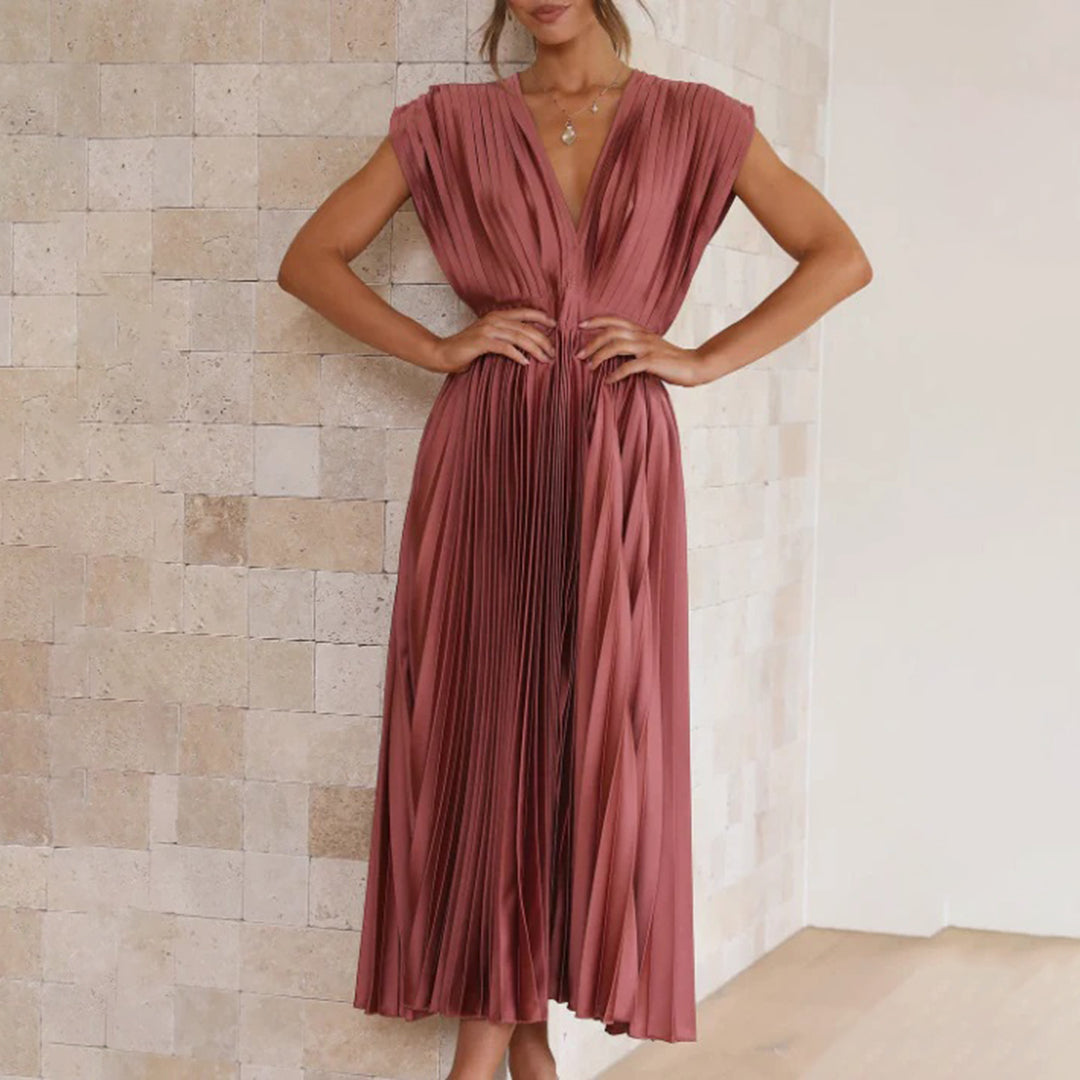 Women's sleek pleated maxi dress with V-neck and short sleeves, for elegant gatherings.