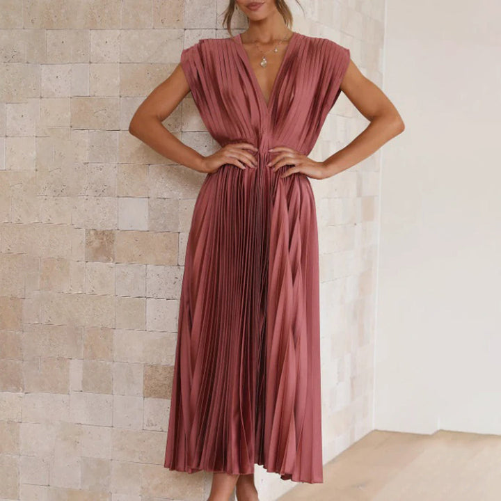 Women's sleek pleated maxi dress with V-neck and short sleeves, for elegant gatherings.