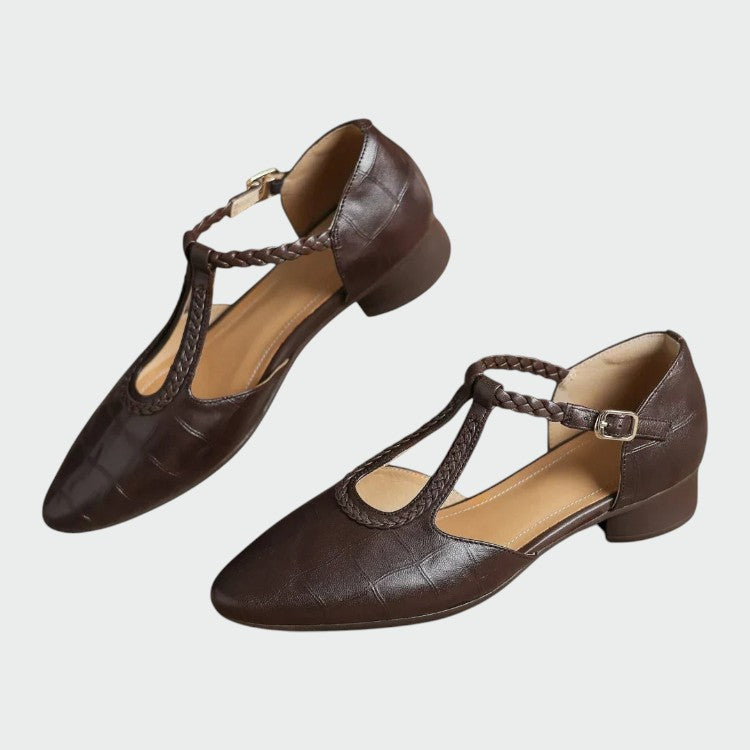 Classic women's T-bar Mary Jane shoes with a stylish pointed toe and secure buckle strap. Elegant and comfortable.