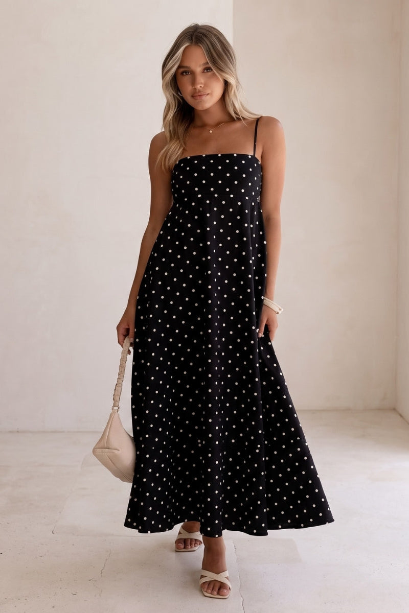 Fashionable women's sleeveless polka dot maxi dress, comfortable and elegant for summer and evening wear.