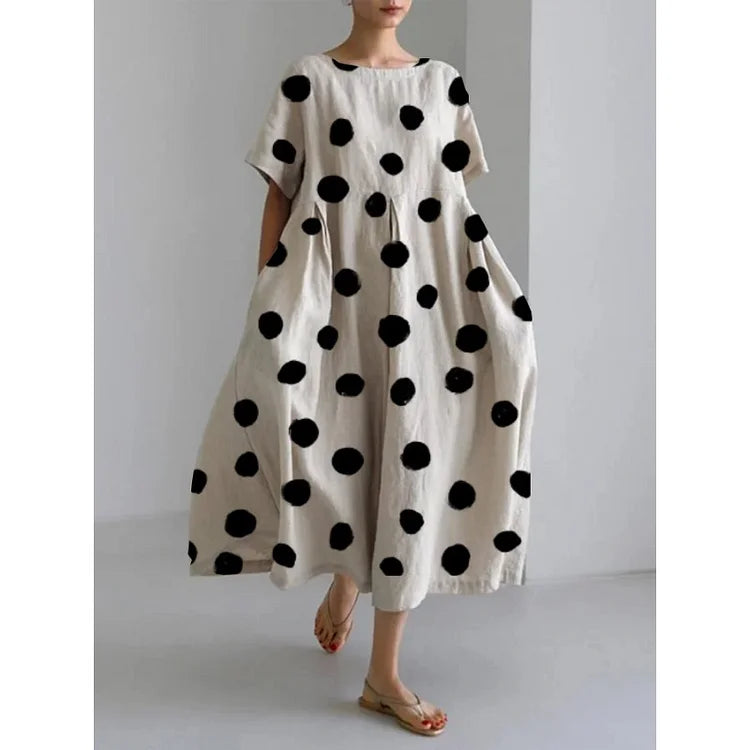Women's elegant polka dot maxi dress with boat neck & short sleeves, perfect for summer casual wear.