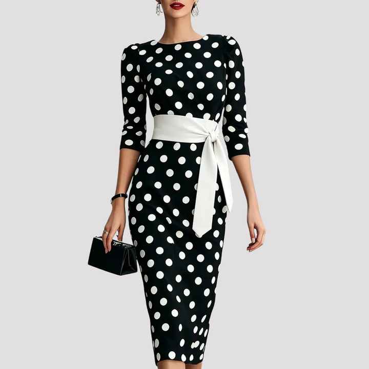 Chic women's belted polka dot midi dress featuring three-quarter sleeves, perfect for a flattering fit.