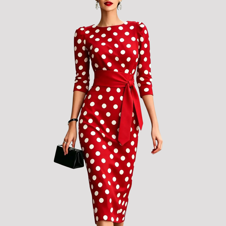 Stylish women's occasion wear belted midi dress with a polka dot print and classic design.