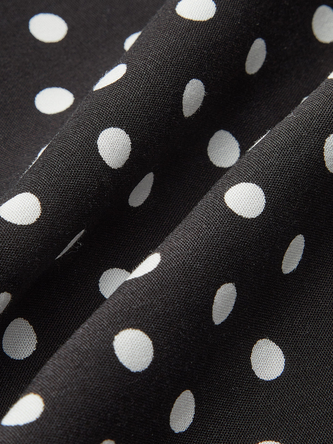 Versatile women's dress: polka dot V-neck maxi style for day or night.