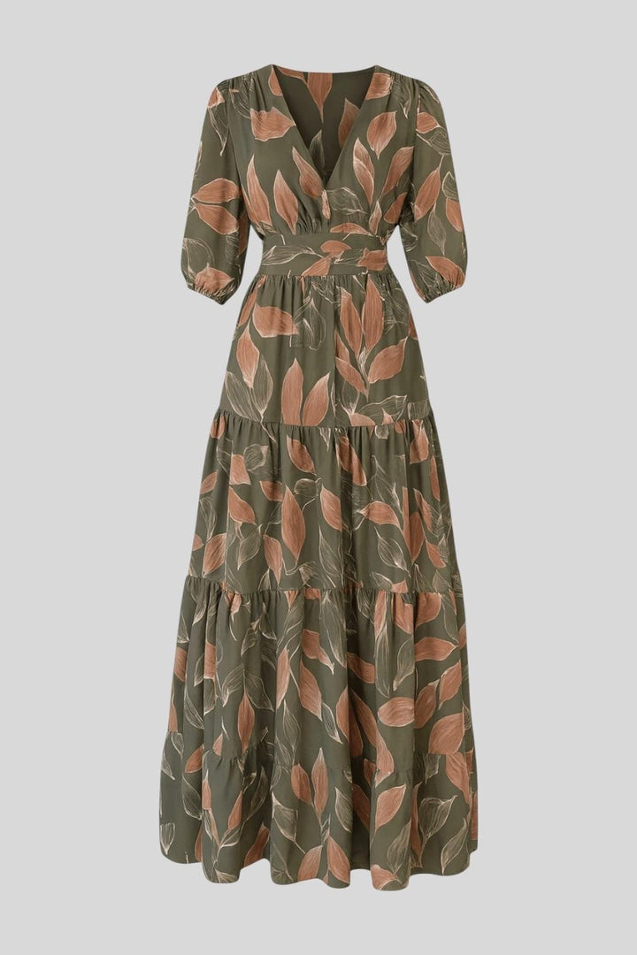 Stylish women's V-neck printed maxi dress. Elegant flowing design, ideal for casual summer or spring events.