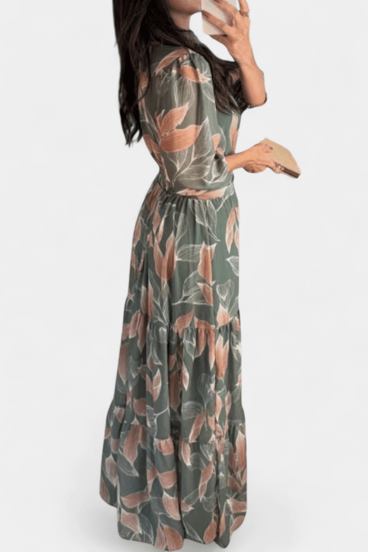 Comfortable women's flowing printed maxi dress. Features a chic V-neck, great for elegant spring casual wear.