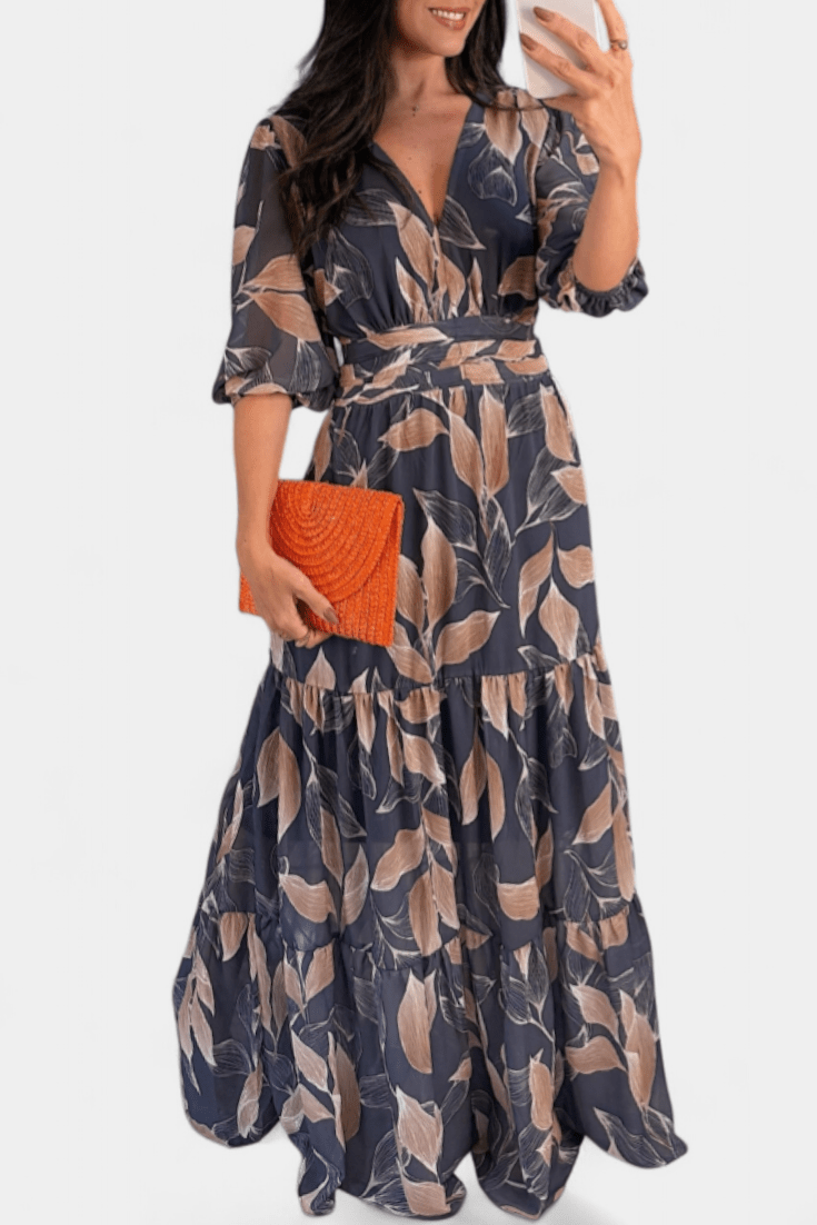 Casual elegant women's V-neck maxi dress with a vibrant print and flowing silhouette, ideal for summer.
