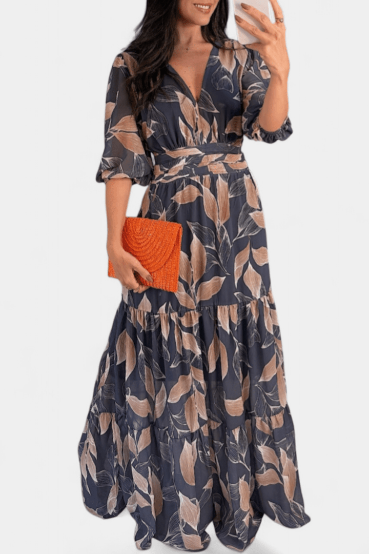 Casual elegant women's V-neck maxi dress with a vibrant print and flowing silhouette, ideal for summer.