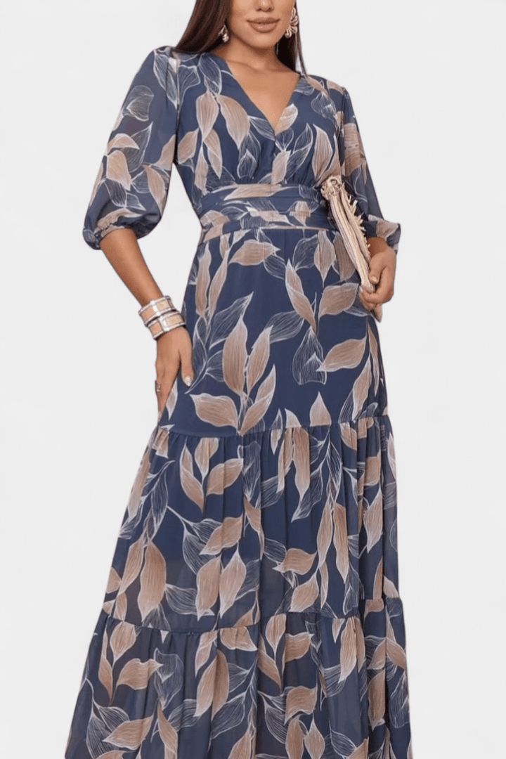 Flowing women's printed summer maxi dress. Features an elegant V-neck and comfortable, flattering design.