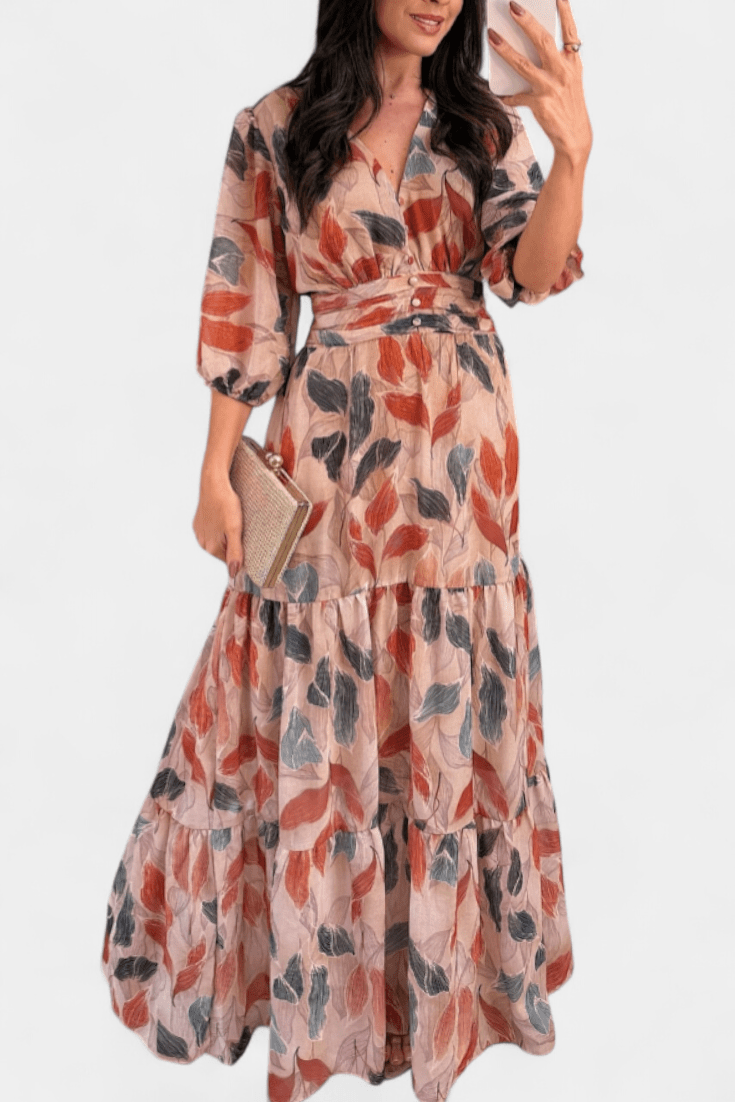 Chic women's printed maxi dress. Elegant V-neck, flowing silhouette, perfect for spring fashion and outings.