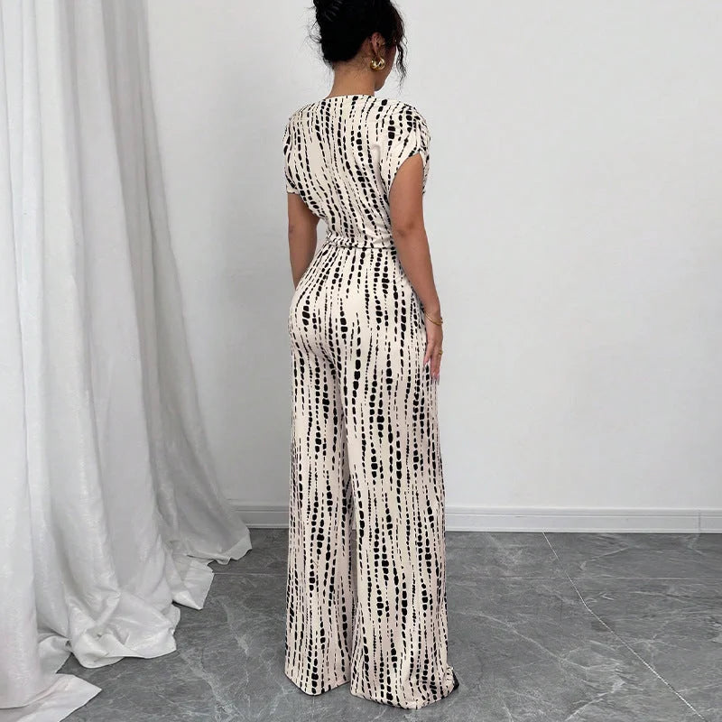 Stylish women's printed one-shoulder wide-leg jumpsuit with belt, ideal for summer fashion, parties & elegant events.