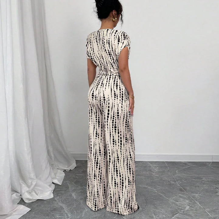 Stylish women's printed one-shoulder wide-leg jumpsuit with belt, ideal for summer fashion, parties & elegant events.