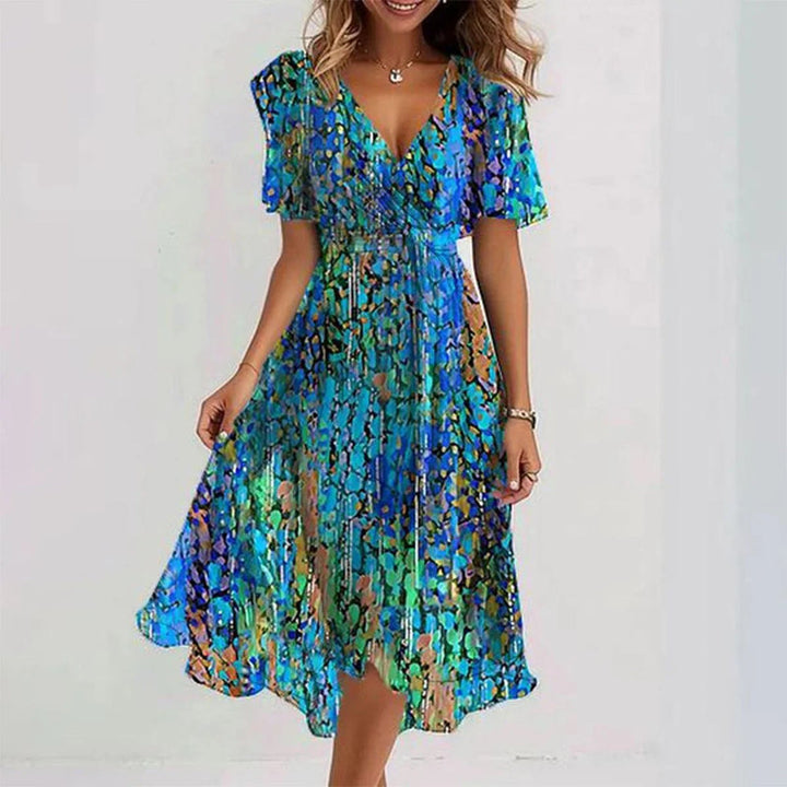 Women's elegant printed V-neck short sleeve midi dress with an asymmetrical hem, perfect for summer casual wear.