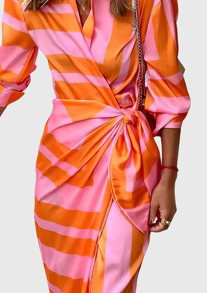 Elegant women's wrap dress, adjustable fit, beautiful print, versatile for day or evening.