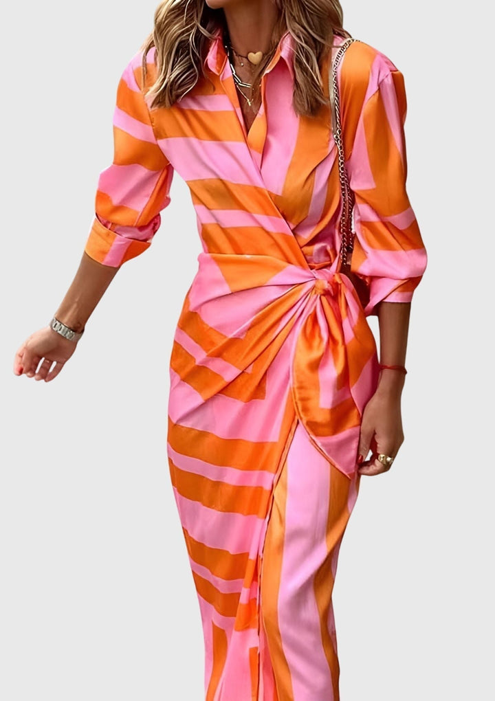 Beautifully printed women's long wrap dress, elegant design, flattering silhouette.