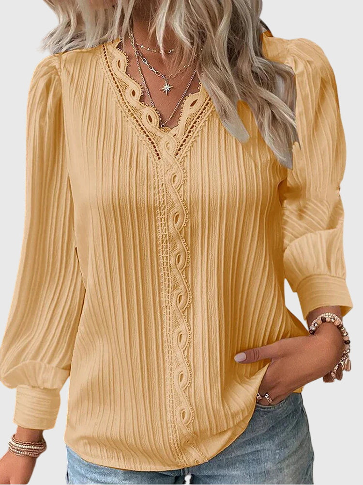 Women's elegant pullover blouse, perfect for chic style. Versatile long sleeve top for any occasion.