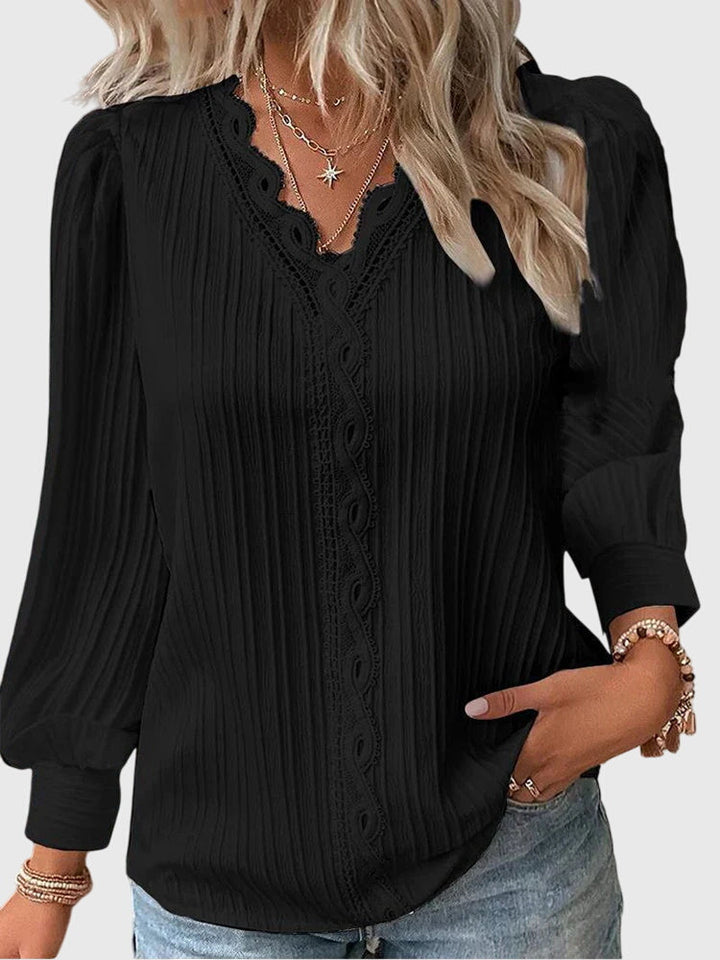 Versatile women's elegant pullover blouse. Chic long sleeve top for both casual and formal wear.