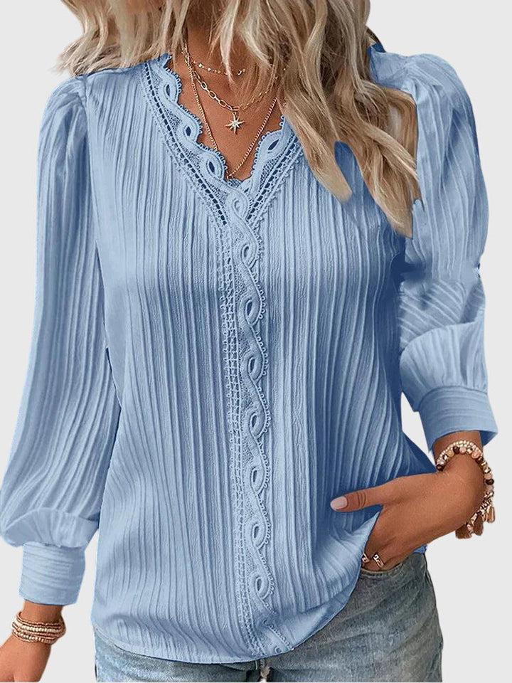 Elegant long sleeve women's pullover blouse, offering chic style and everyday comfort. Stylish fashion.
