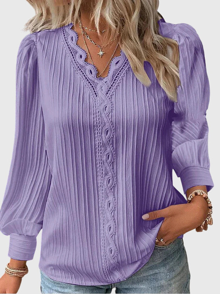 Chic women's elegant pullover blouse. A versatile long sleeve top, ideal for a refined casual or formal look.