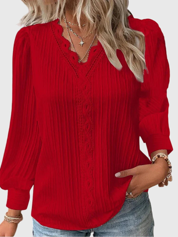 Comfortable women's pullover blouse with elegant design. Stylish long sleeve top for everyday chic fashion.