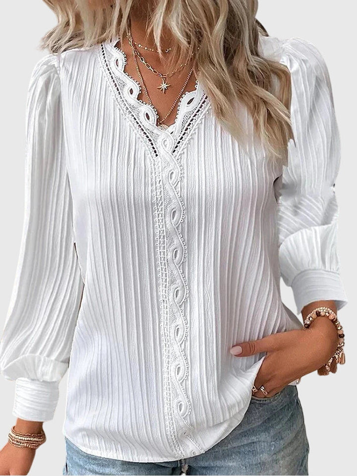 Sophisticated women's pullover blouse, elegant long sleeve top for versatile chic style and comfort.