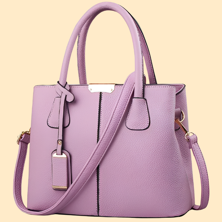 Women's elegant purple leather shoulder bag, a versatile everyday and evening fashion accessory.