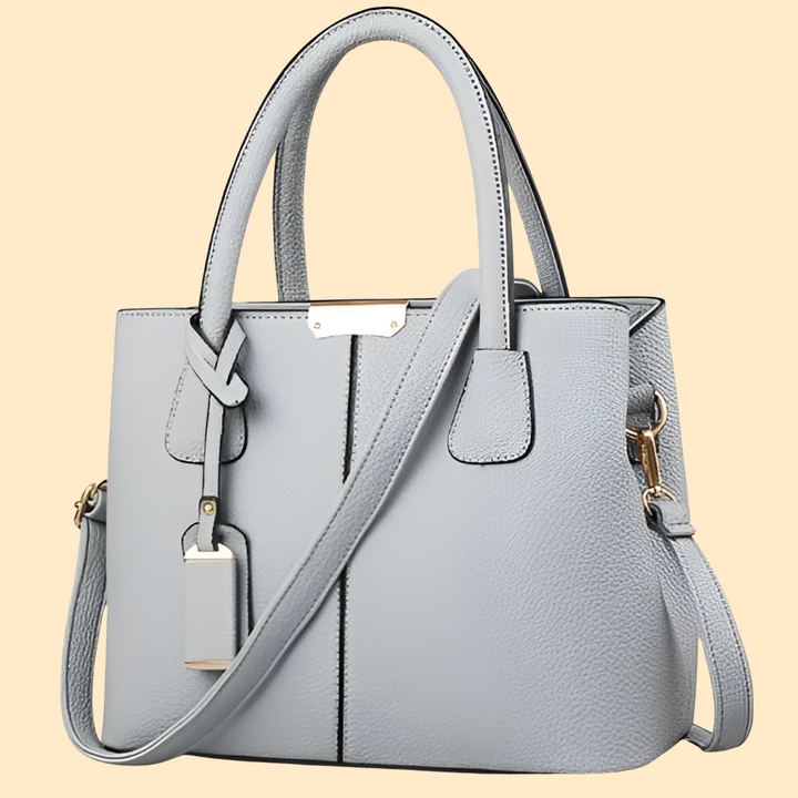 Chic structured leather shoulder bag in a rich purple hue, ideal for the modern woman.