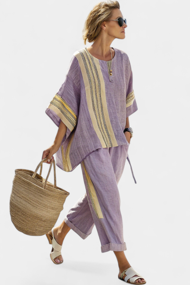 Versatile blue striped women's set, comfortable relaxed fit top & trousers, for elegant or casual wear.