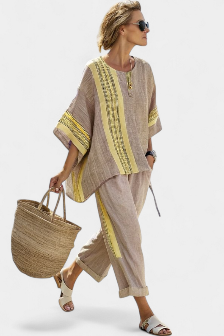 Green striped women's elegant two-piece set, featuring a relaxed fit top and comfortable trousers.