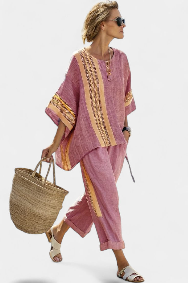 Comfortable purple striped women's set with elegant top and relaxed fit trousers, ideal for casual wear.