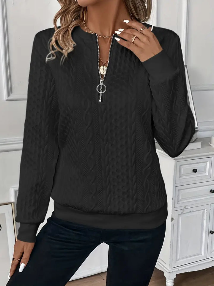 Women's elegant long sleeve sweater, featuring a practical quarter zip design.