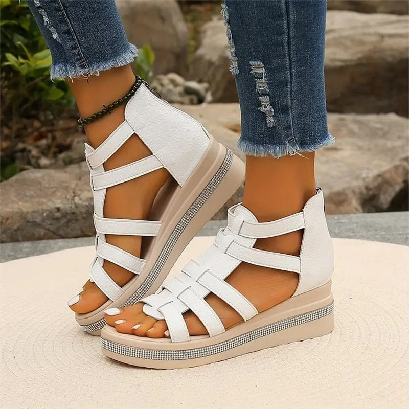 Women's fashionable rhinestone wedge sandals, offering a dazzling touch to summer outfits.