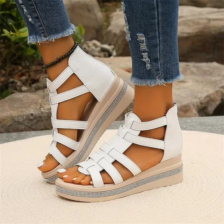 Women's fashionable rhinestone wedge sandals, offering a dazzling touch to summer outfits.