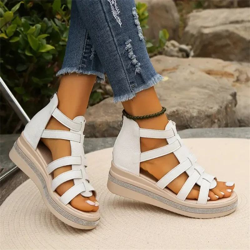 Elegant women's summer sandals, featuring a comfortable wedge and shimmering rhinestones.